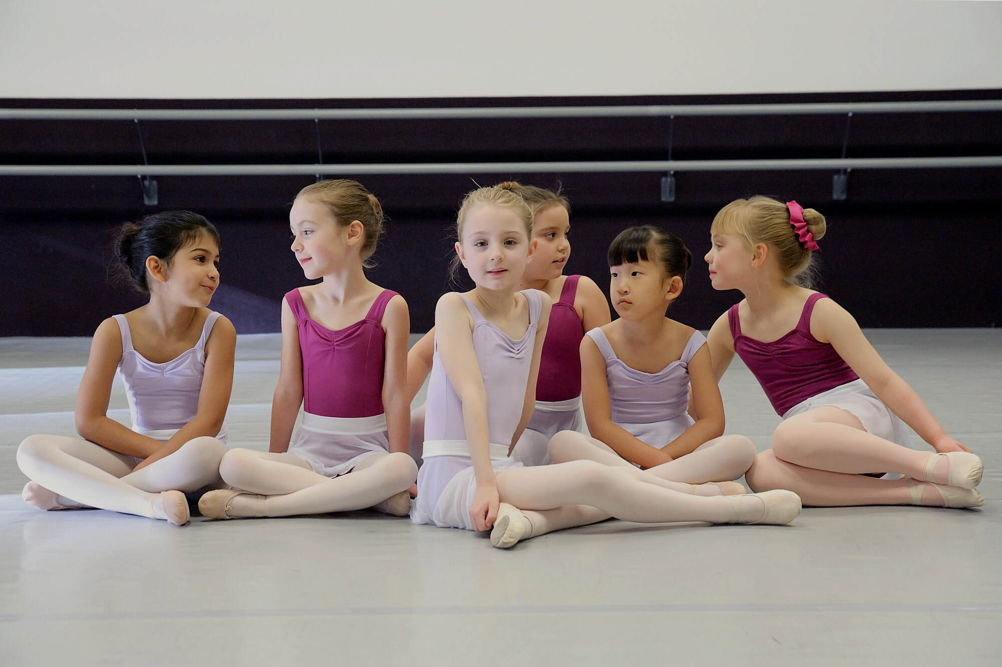 Young GWDC ballet students seated together in the studio